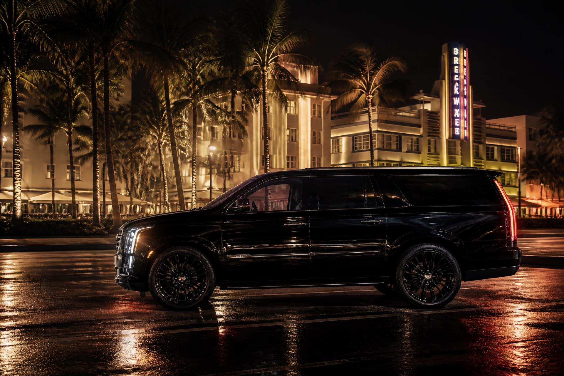 Black Cadillac Escalade on Ocean Drive at night